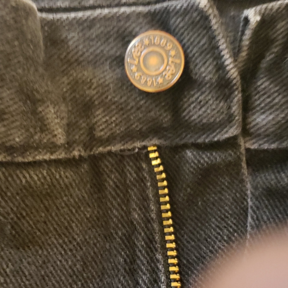 Black pair of unisex Lee Jeans